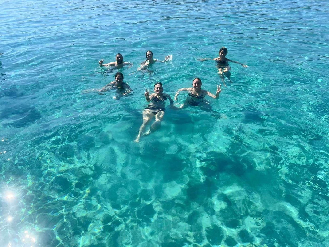 Swimming from the boat in turquoise water